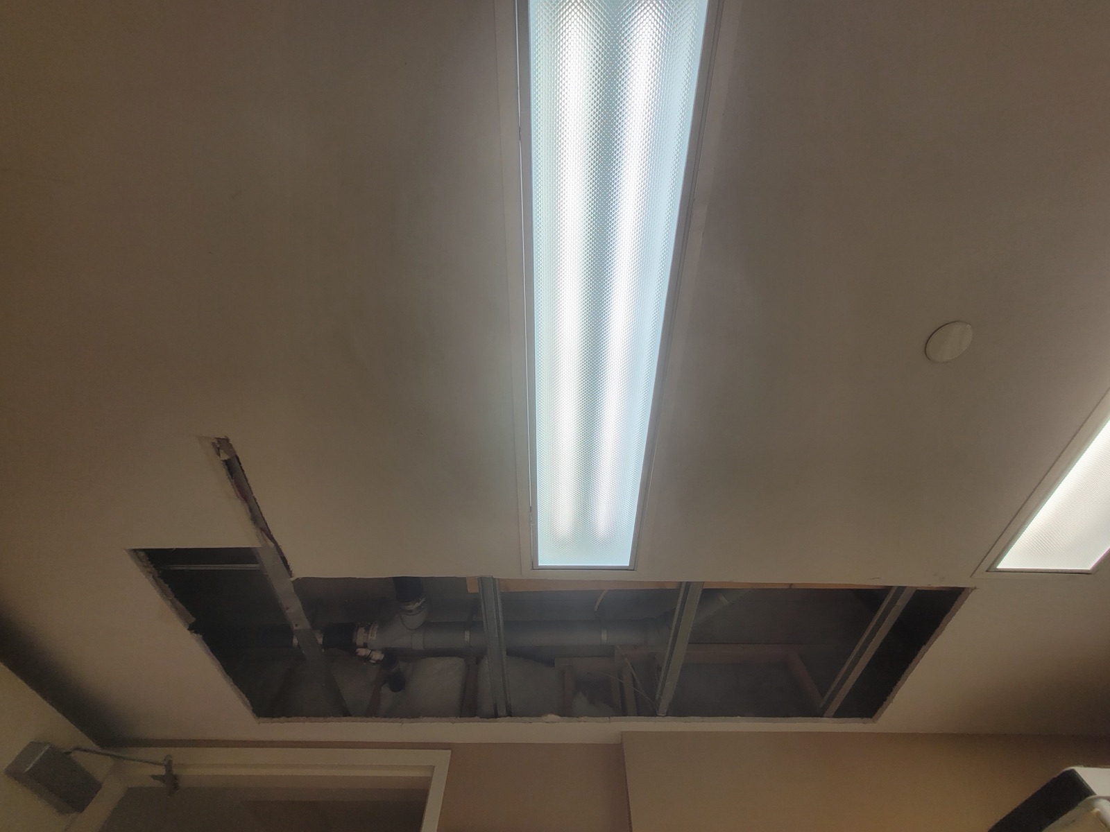 Commercial Ceiling Cut Open by Aymont Drywall
